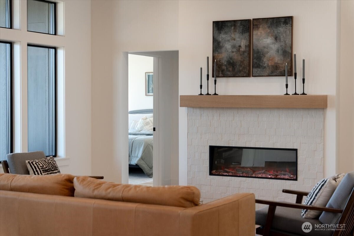 982 Spring Mountain Drive Wenatchee, WA 98801 - Photo 11 of 36 a living room with a couch and a fireplace