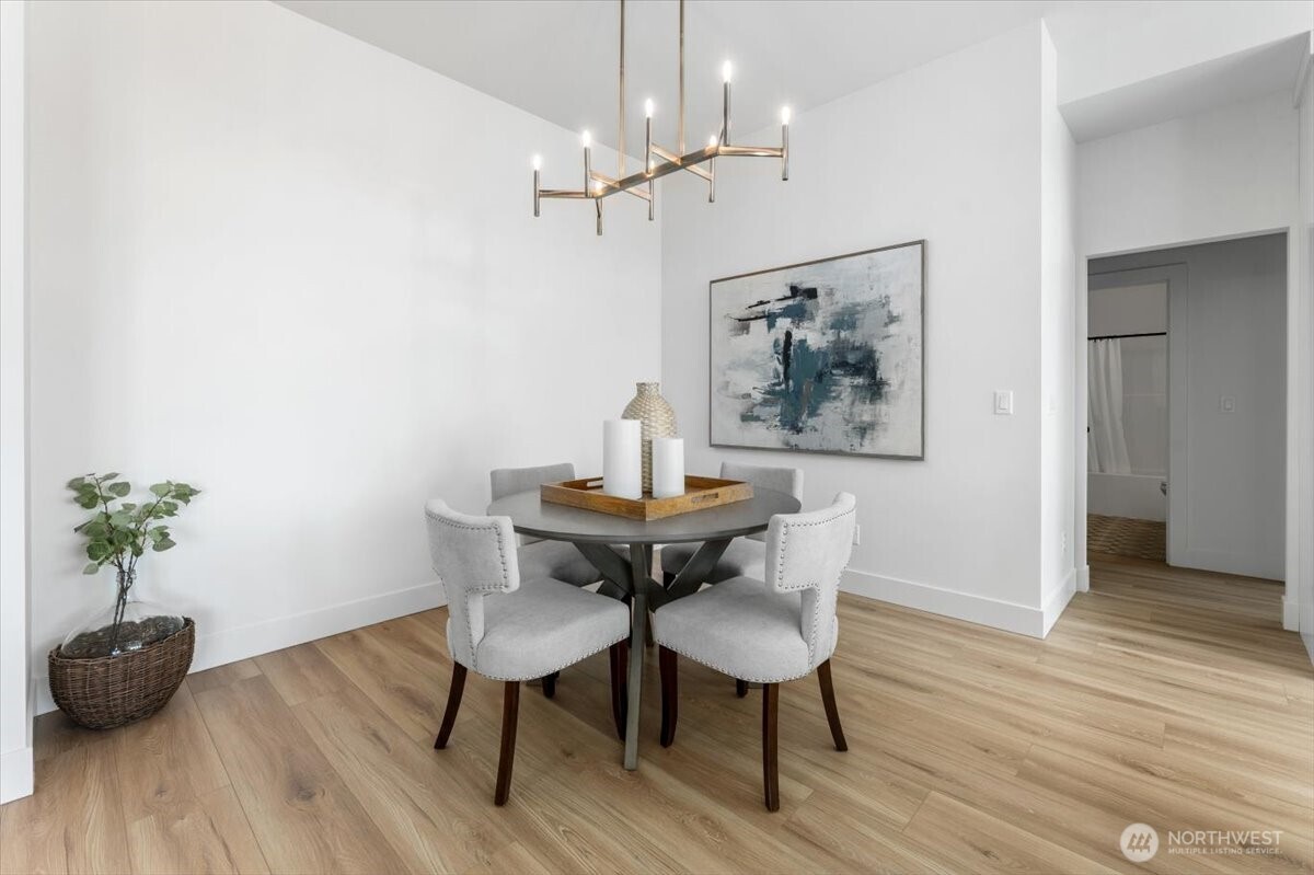 982 Spring Mountain Drive Wenatchee, WA 98801 - Photo 13 of 36 a view of a dining room with furniture and wooden floor