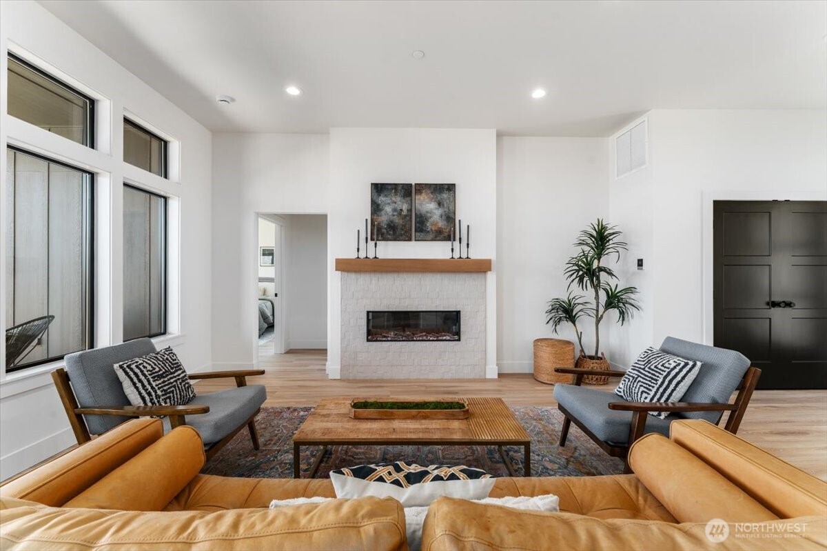 982 Spring Mountain Drive Wenatchee, WA 98801 - Photo 5 of 36 a living room with furniture and a fireplace