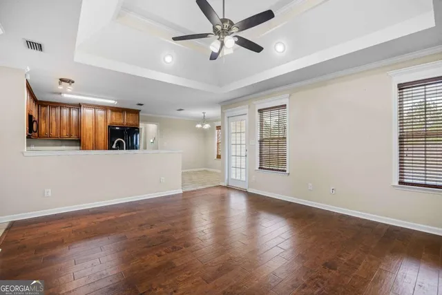 a view of a livingroom with wooden floor