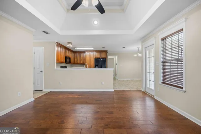 a view of an empty room with a window