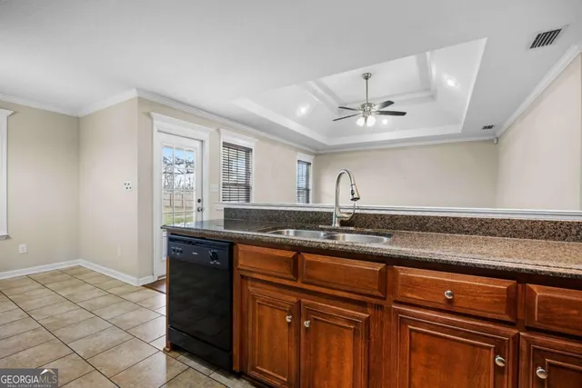a view of a kitchen with a sink and a window
