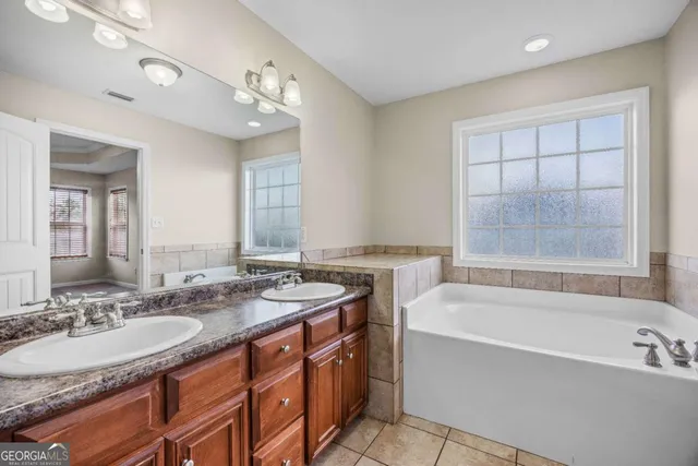 a view of a house with a backyard