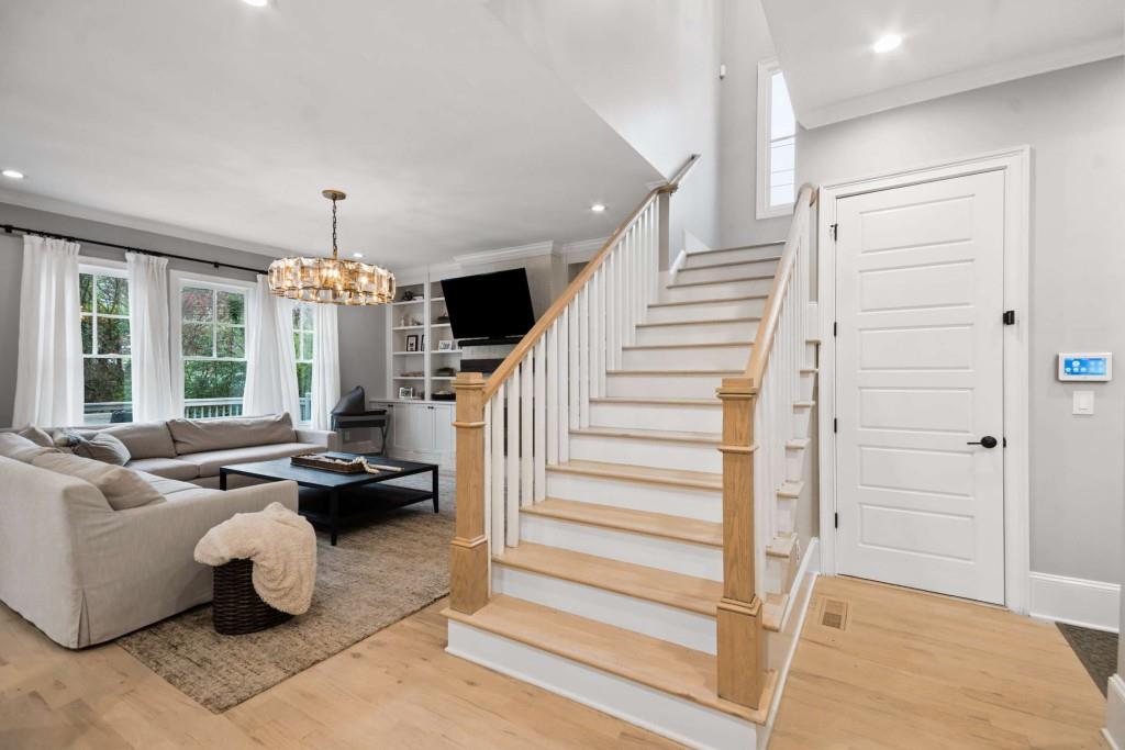 2561 Thompson Road Northeast Brookhaven, GA 30319 - Photo 17 of 47 a living room with furniture and a chandelier