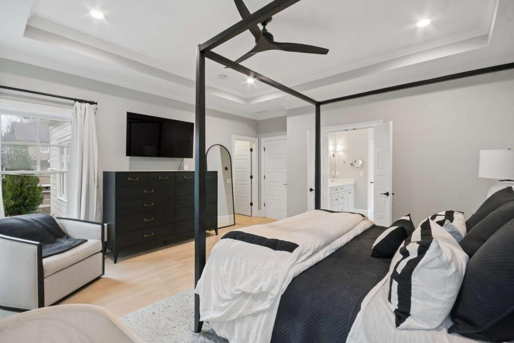 2561 Thompson Road Northeast Brookhaven, GA 30319 - Photo 19 of 47 a bedroom with a bed and a flat screen tv