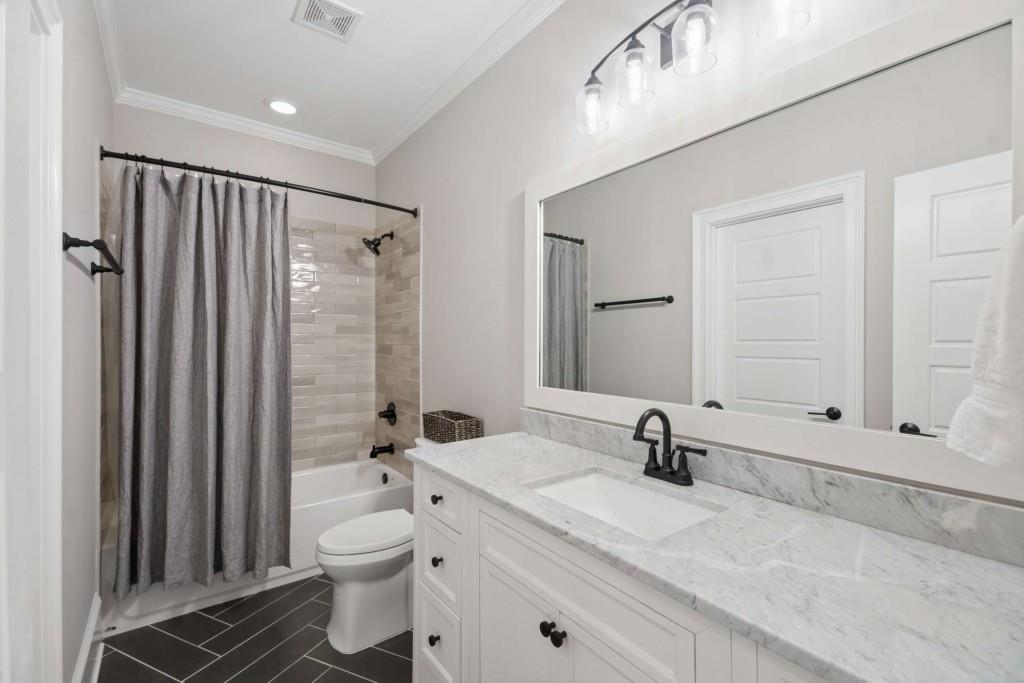 2561 Thompson Road Northeast Brookhaven, GA 30319 - Photo 24 of 47 a bathroom with a sink a toilet and shower