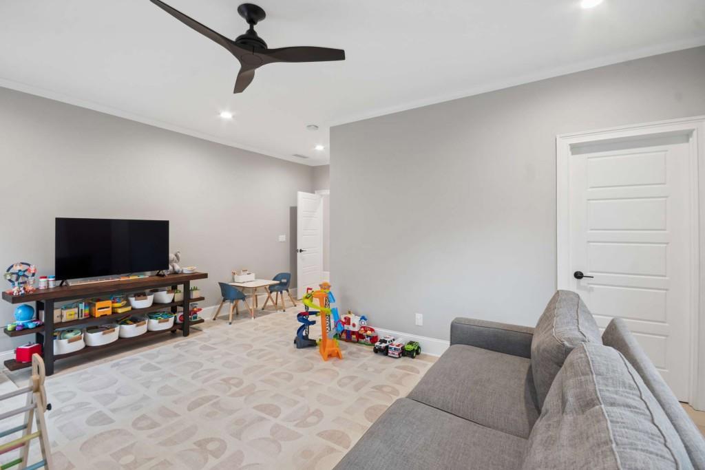 2561 Thompson Road Northeast Brookhaven, GA 30319 - Photo 28 of 47 a living room with furniture and a flat screen tv