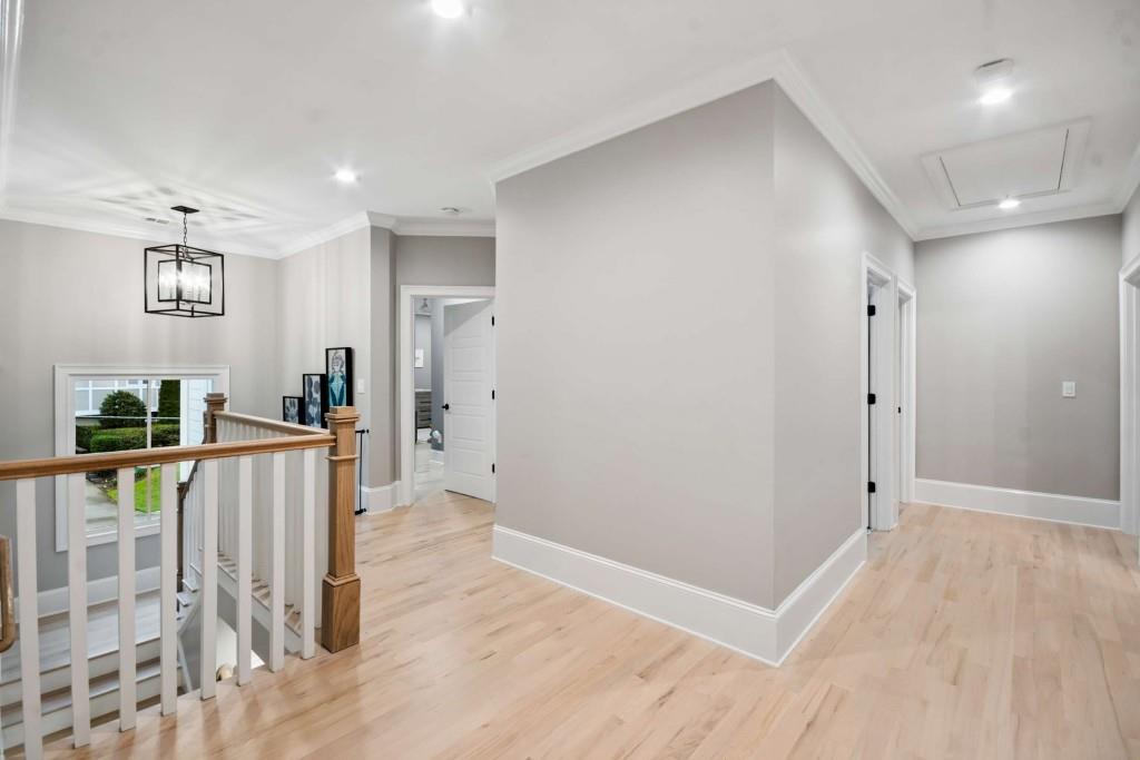 2561 Thompson Road Northeast Brookhaven, GA 30319 - Photo 31 of 47 a view of a hallway with wooden floor and entryway
