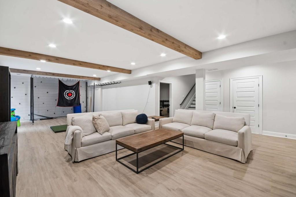 2561 Thompson Road Northeast Brookhaven, GA 30319 - Photo 35 of 47 a living room with furniture and a wooden floor