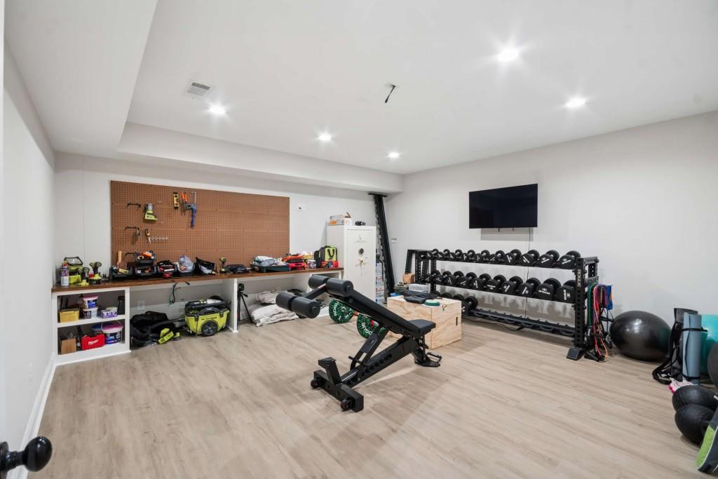 2561 Thompson Road Northeast Brookhaven, GA 30319 - Photo 36 of 47 a living room with furniture gym equipment and a flat screen tv