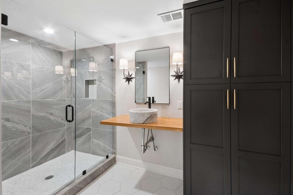 2561 Thompson Road Northeast Brookhaven, GA 30319 - Photo 37 of 47 a bathroom with a shower sink and mirror