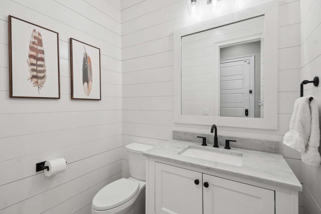 2561 Thompson Road Northeast Brookhaven, GA 30319 - Photo 38 of 47 a bathroom with a granite countertop toilet sink and mirror