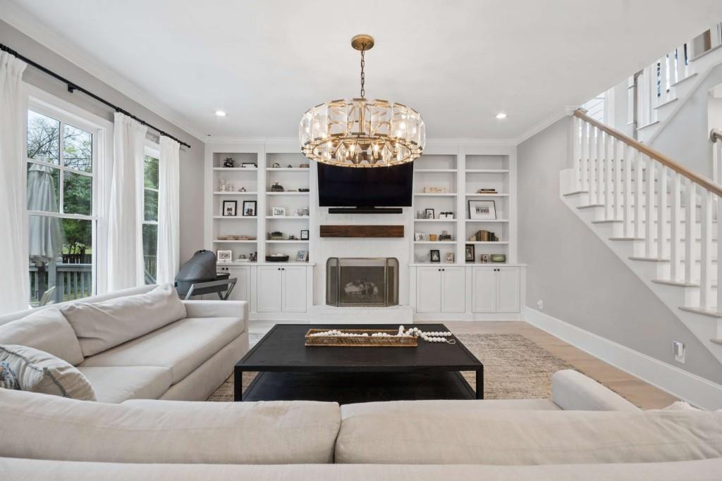 2561 Thompson Road Northeast Brookhaven, GA 30319 - Photo 5 of 47 a living room with furniture and a fireplace