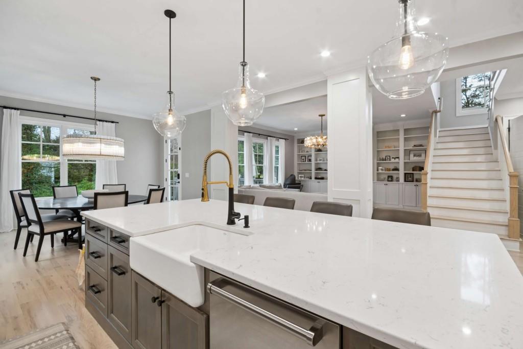 2561 Thompson Road Northeast Brookhaven, GA 30319 - Photo 8 of 47 a large white kitchen with a large island