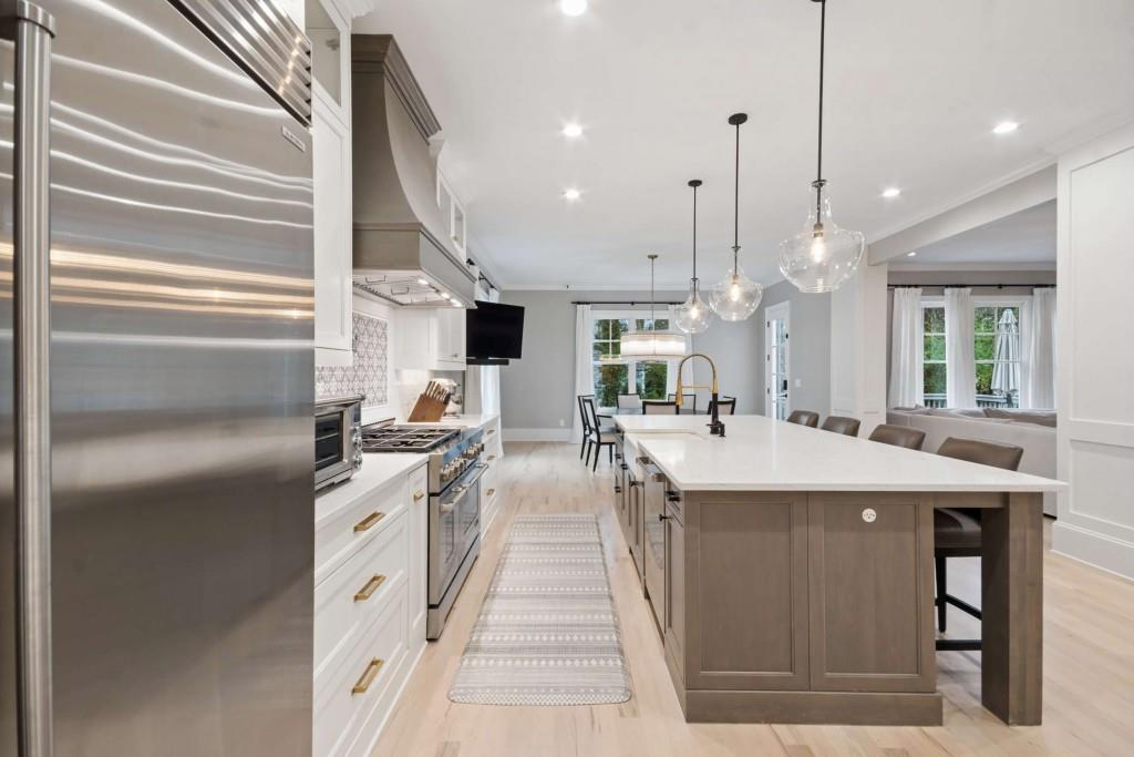 2561 Thompson Road Northeast Brookhaven, GA 30319 - Photo 9 of 47 a kitchen with stainless steel appliances granite countertop a sink a stove and a refrigerator