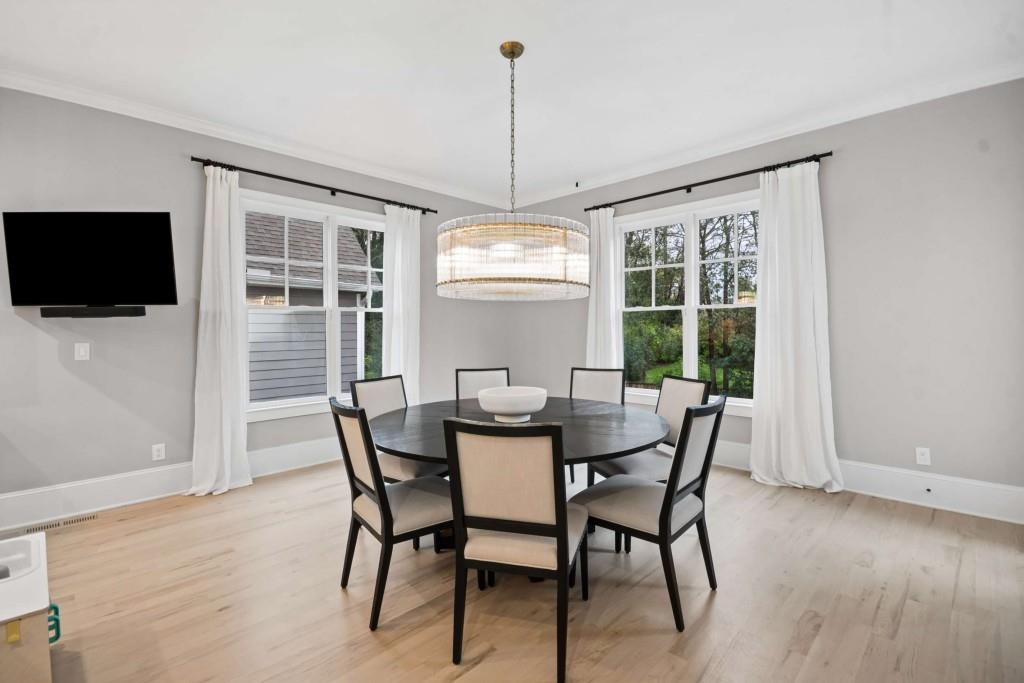2561 Thompson Road Northeast Brookhaven, GA 30319 - Photo 10 of 47 a dining room with furniture window wooden floor