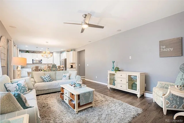 a living room with furniture and a table