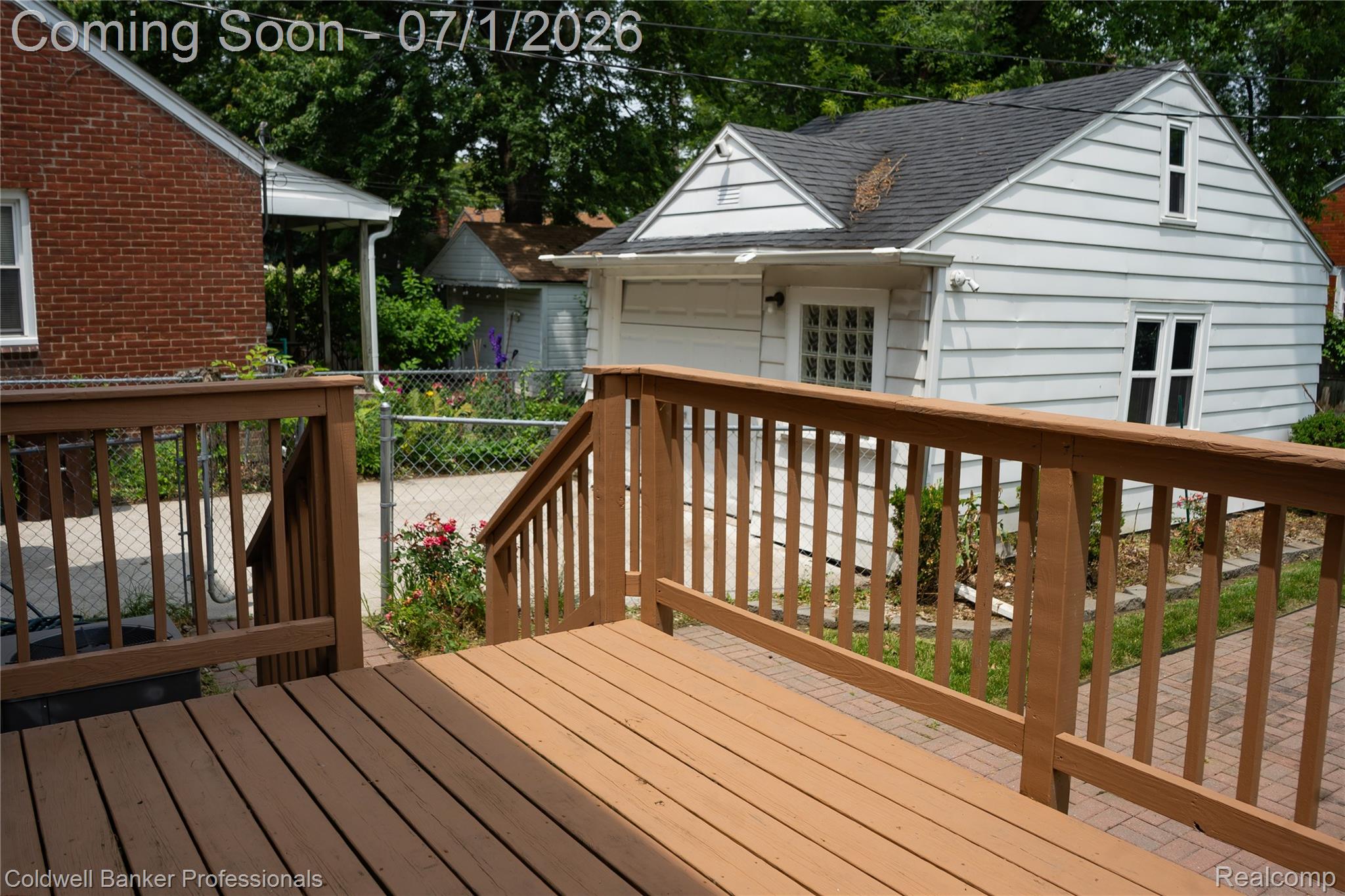 1168 Vernier Road Grosse Pointe, MI 48236 - Photo 22 of 32 Spacious rear deck featuring warm-toned wood-finish flooring and matching railings