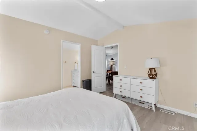 a bedroom with a bed and dresser