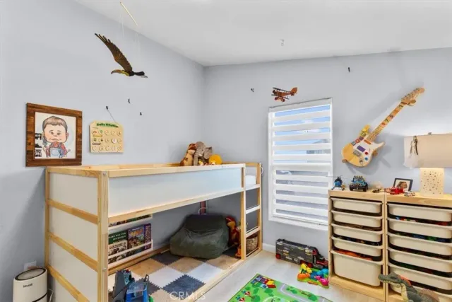 a room with furniture and a baby crib