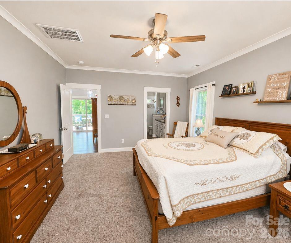 699 Sellerstown Road Cherryville, NC 28021 - Photo 13 of 22 a bedroom with a bed and dresser with mirror