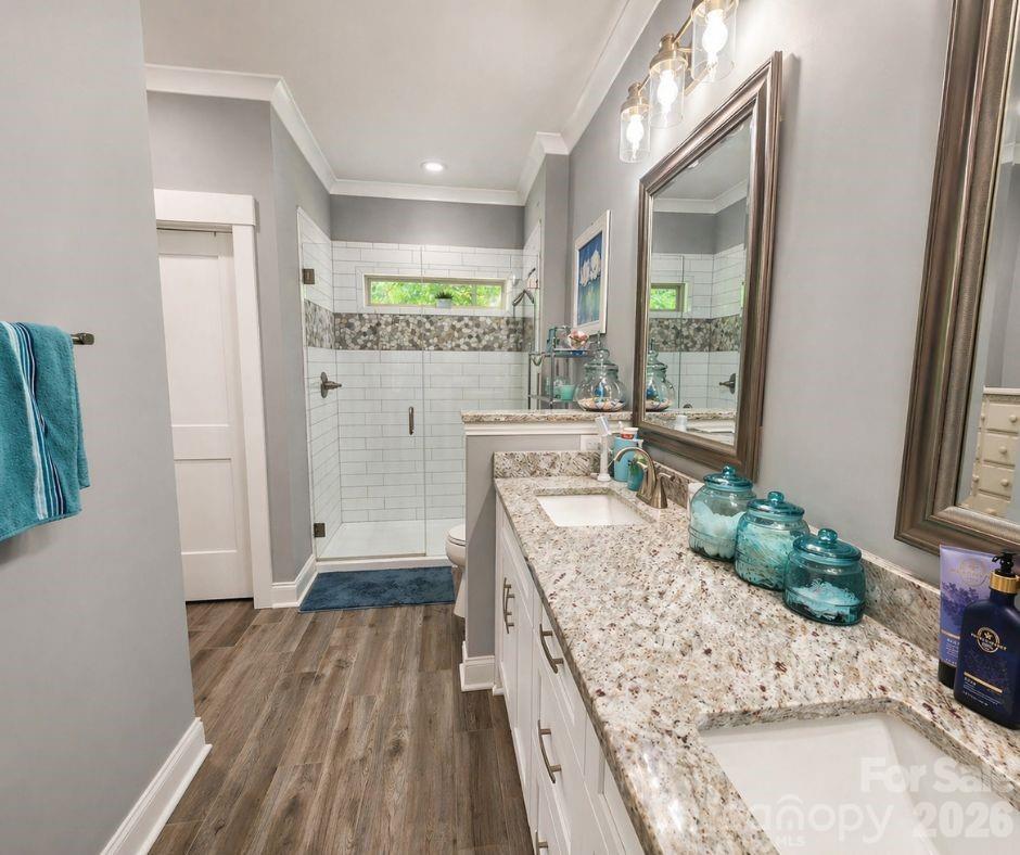 699 Sellerstown Road Cherryville, NC 28021 - Photo 14 of 22 a room with kitchen island granite countertop wooden floor and a large window