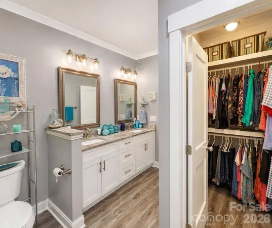 a spacious bathroom with a double vanity sink and a mirror