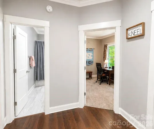 a view of a bedroom from a hallway