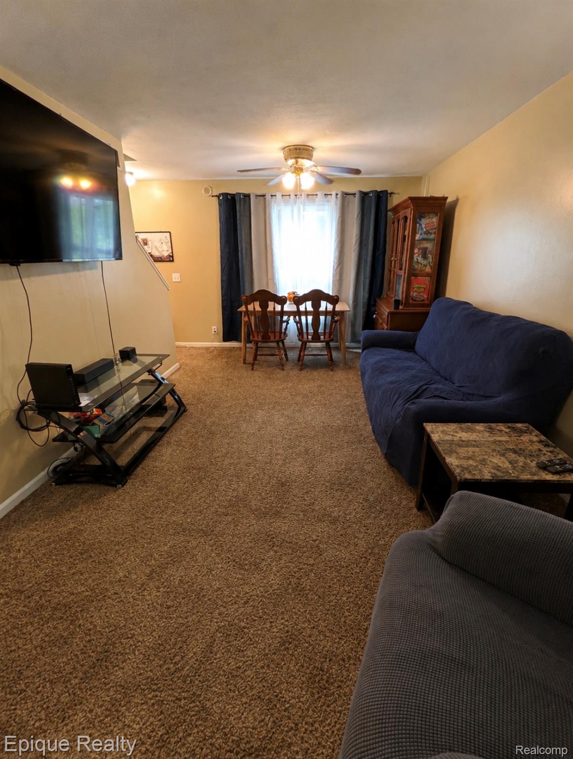 11619 Read Avenue Mount Morris, MI 48458 - Photo 2 of 10 Living area featuring light-toned wall paint and brown textured carpeting