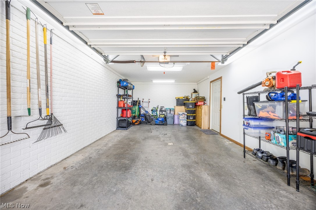1602 Glendale Road, Unit 3 Marietta, OH 45750 - Photo 36 of 49 Garage with concrete flooring, white painted walls, and overhead lighting