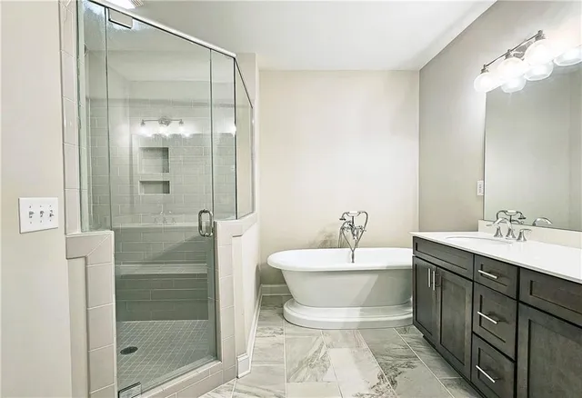 a bathroom with a double vanity sink mirror and toilet