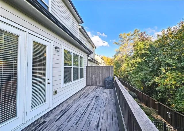 a view of balcony with wooden floor