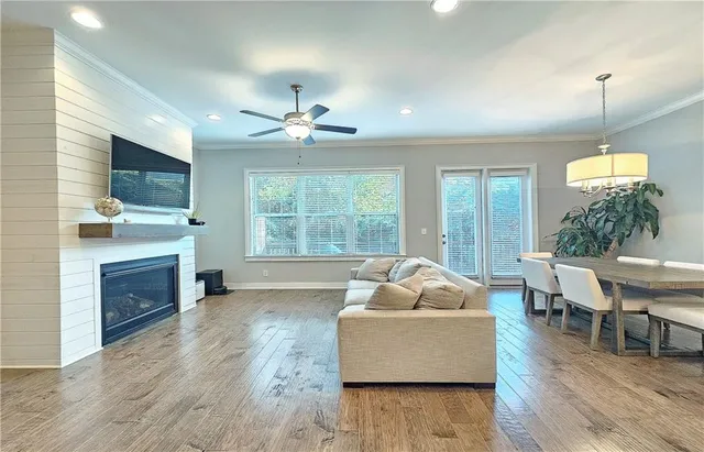 a living room with furniture fireplace and flat screen tv