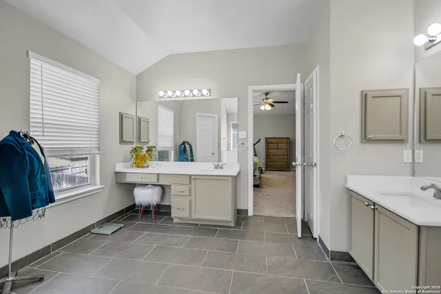 a bathroom with a sink a mirror and a bathtub