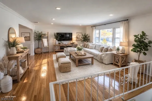 a living room with furniture fireplace and a flat screen tv