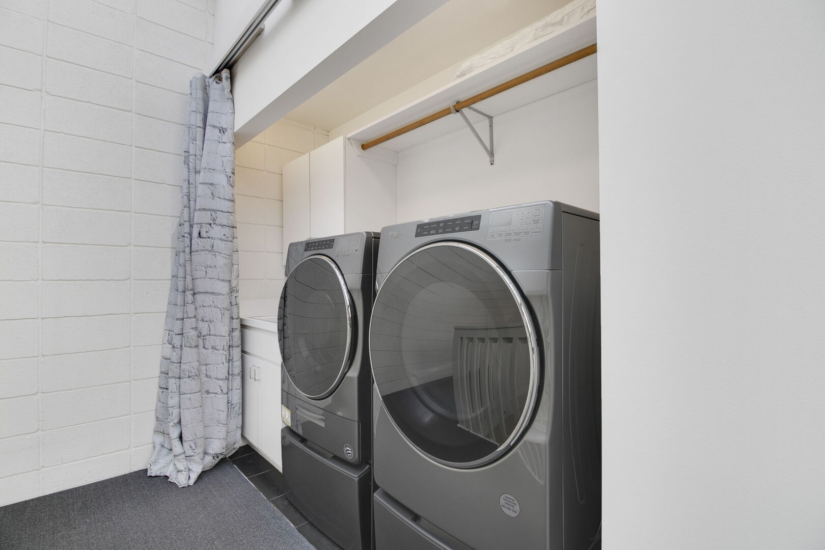 241 East Burlington Street, Unit C Riverside, IL 60546 - Photo 22 of 27 a close view of a utility room with dryer and washer