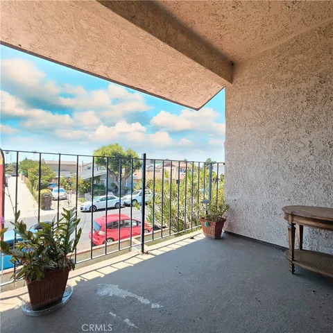 a bedroom with a bed and a desk