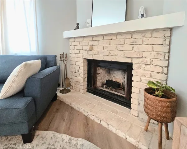 a kitchen with white cabinets sink and stainless steel appliances