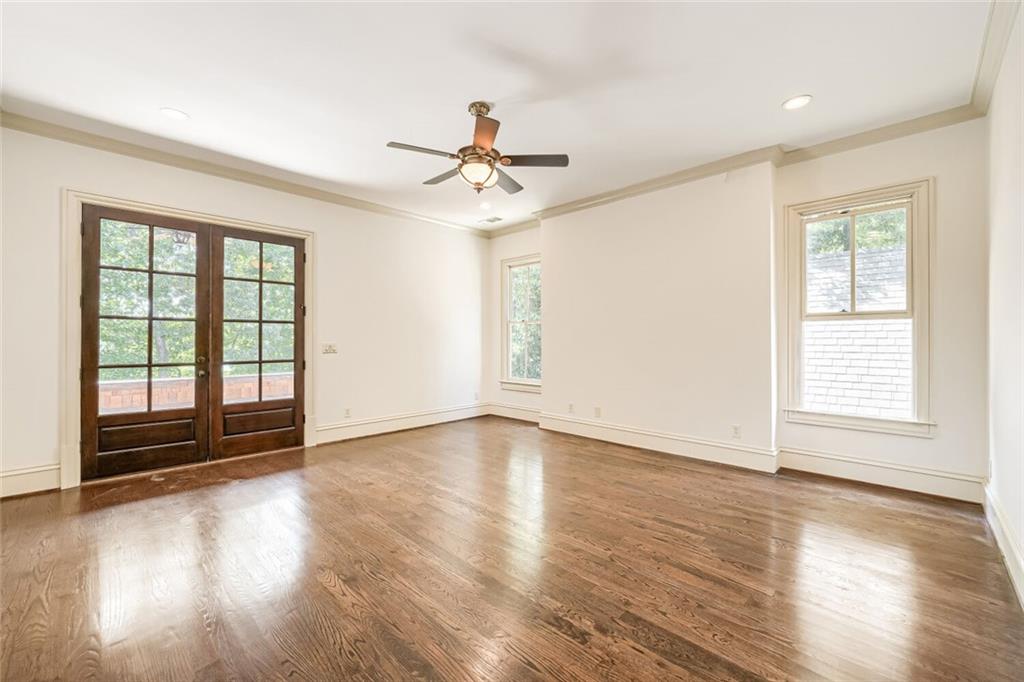 7965 Robin Road Cumming, GA 30041 - Photo 31 of 64 a view of an empty room with wooden floor and a window