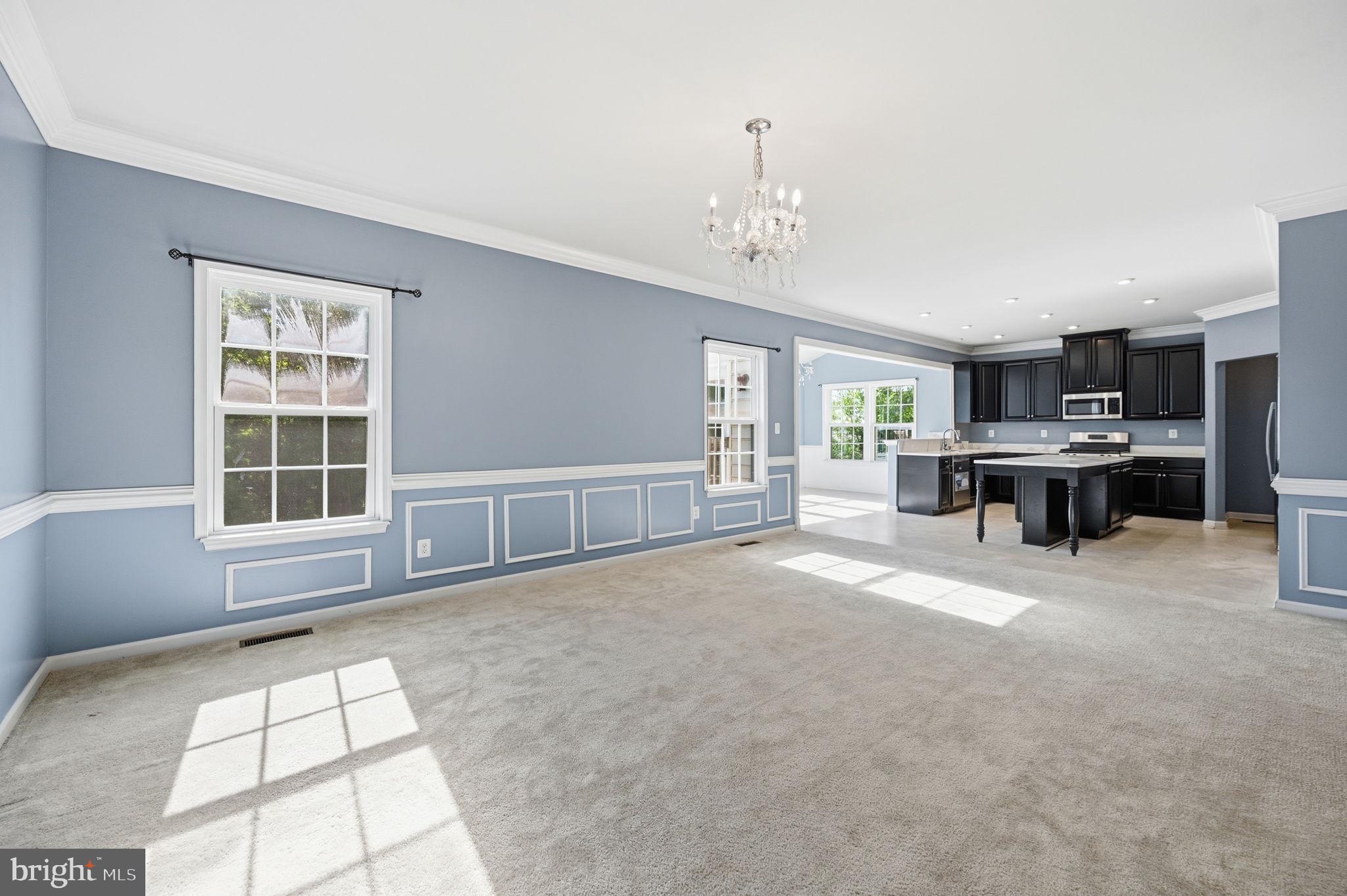 687 Blossom Tree Road Culpeper, VA 22701 - Photo 5 of 31 a view of a livingroom with furniture and a kitchen