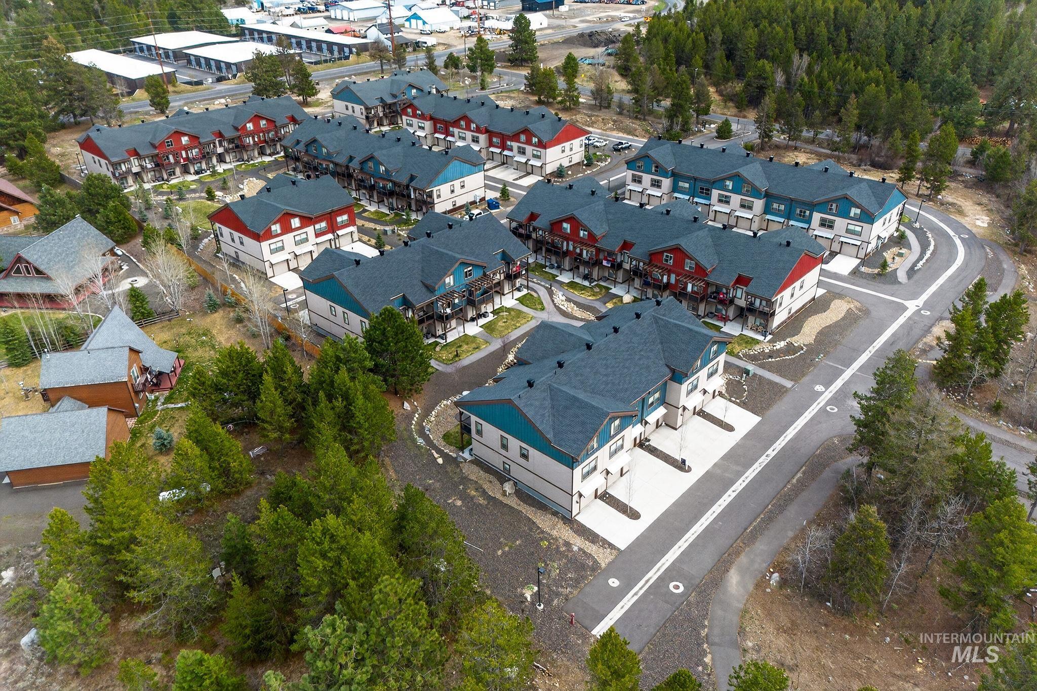 311 Broken Ridge Way McCall, ID 83638 - Photo 36 of 44 Contemporary multi-unit residential development featuring varied building colors, dark shingle roofing, and paved roadways