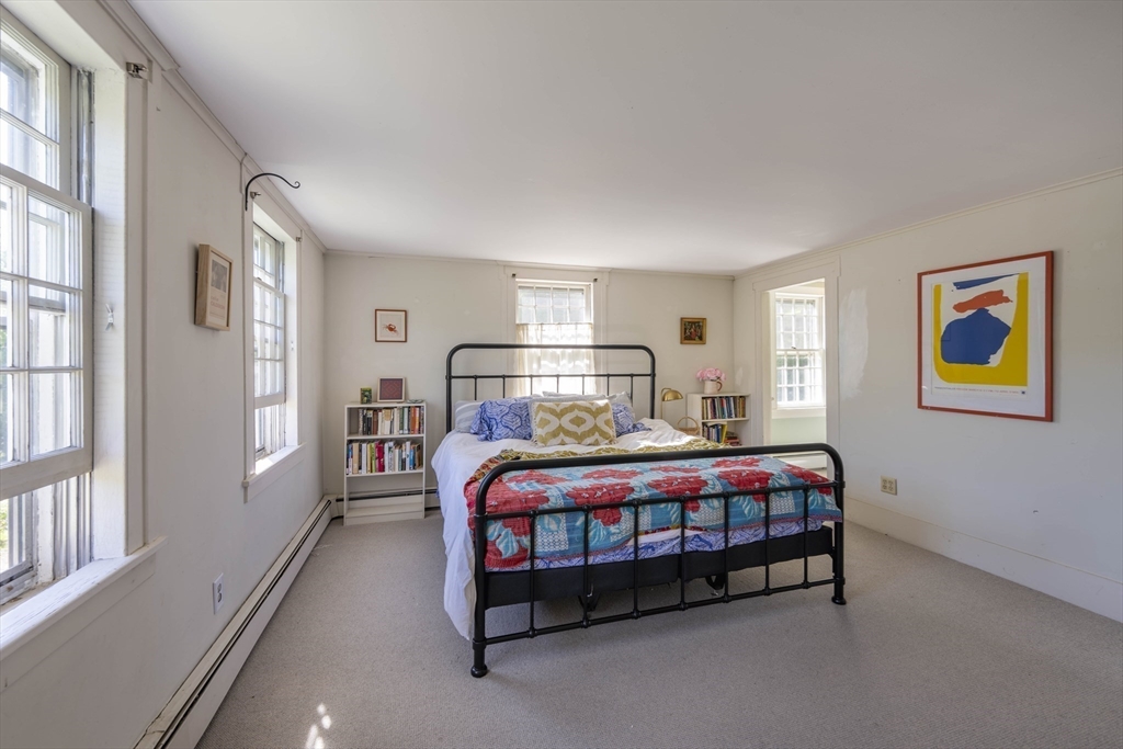 2 Chestnut Hill Road Leverett, MA 01054 - Photo 22 of 42 a bedroom with a bed lamp and a window