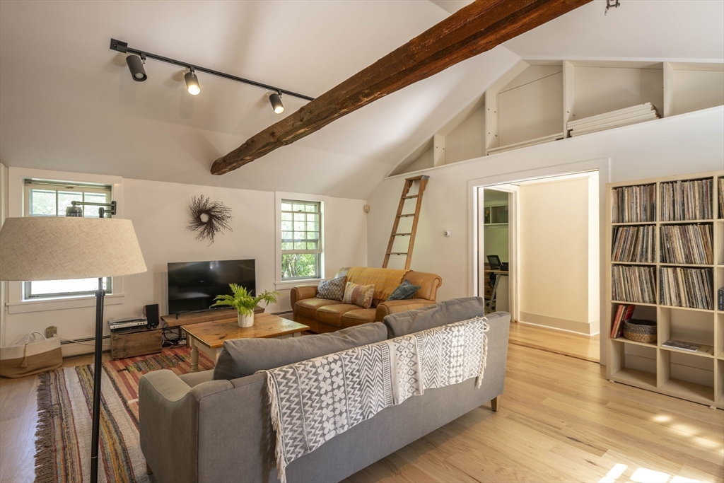 2 Chestnut Hill Road Leverett, MA 01054 - Photo 31 of 42 a living room with furniture a flat screen tv and a table
