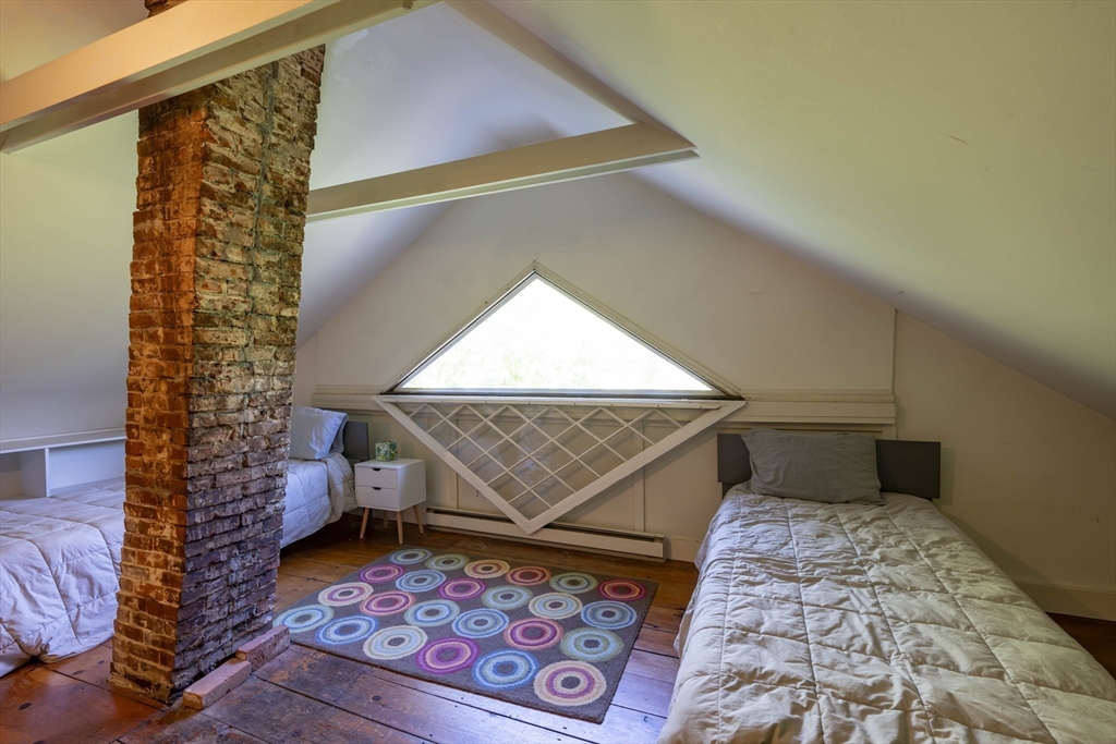 2 Chestnut Hill Road Leverett, MA 01054 - Photo 35 of 42 a bedroom with a bed and a painting on the wall