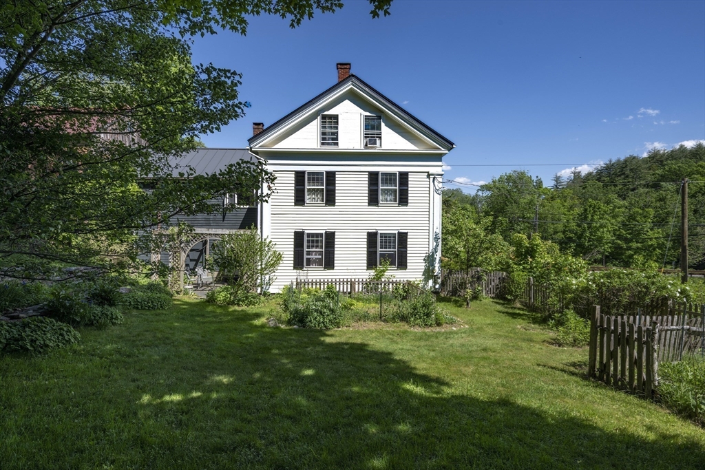 2 Chestnut Hill Road Leverett, MA 01054 - Photo 5 of 42 a front view of a house with a yard