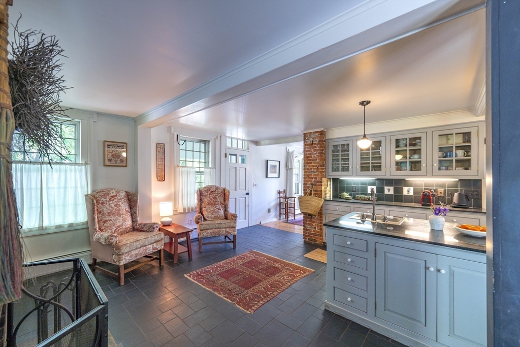 2 Chestnut Hill Road Leverett, MA 01054 - Photo 10 of 42 a living room with furniture fireplace and wooden floor