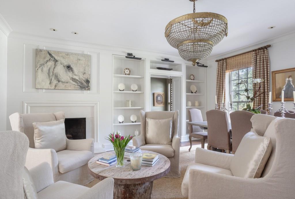 3741 Dumbarton Road Northwest Atlanta, GA 30327 - Photo 11 of 41 a living room with furniture a chandelier and a fireplace