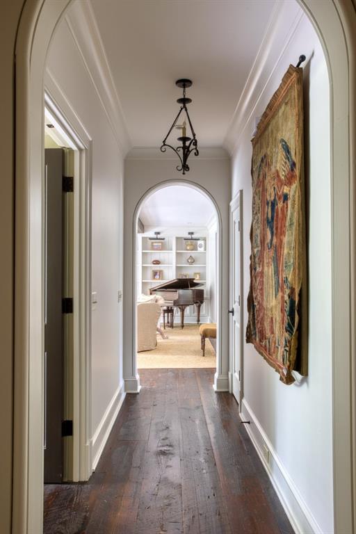 3741 Dumbarton Road Northwest Atlanta, GA 30327 - Photo 17 of 41 a view of a hallway with wooden floor and a fireplace