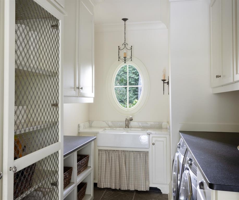 3741 Dumbarton Road Northwest Atlanta, GA 30327 - Photo 21 of 41 a bathroom with a sink a mirror and a window