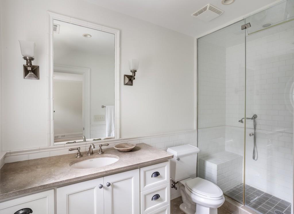 3741 Dumbarton Road Northwest Atlanta, GA 30327 - Photo 25 of 41 a bathroom with a granite countertop sink toilet and shower